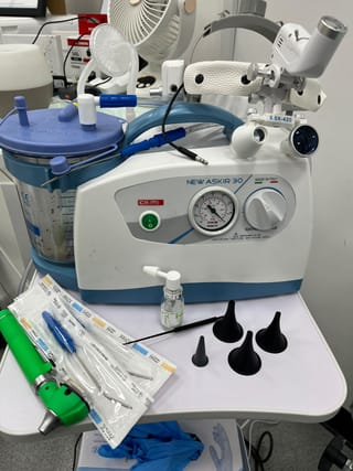 Ear microsuction equipment at The Leech Clinic: the suction unit, ear specula and single-use instruments ready for a treatment